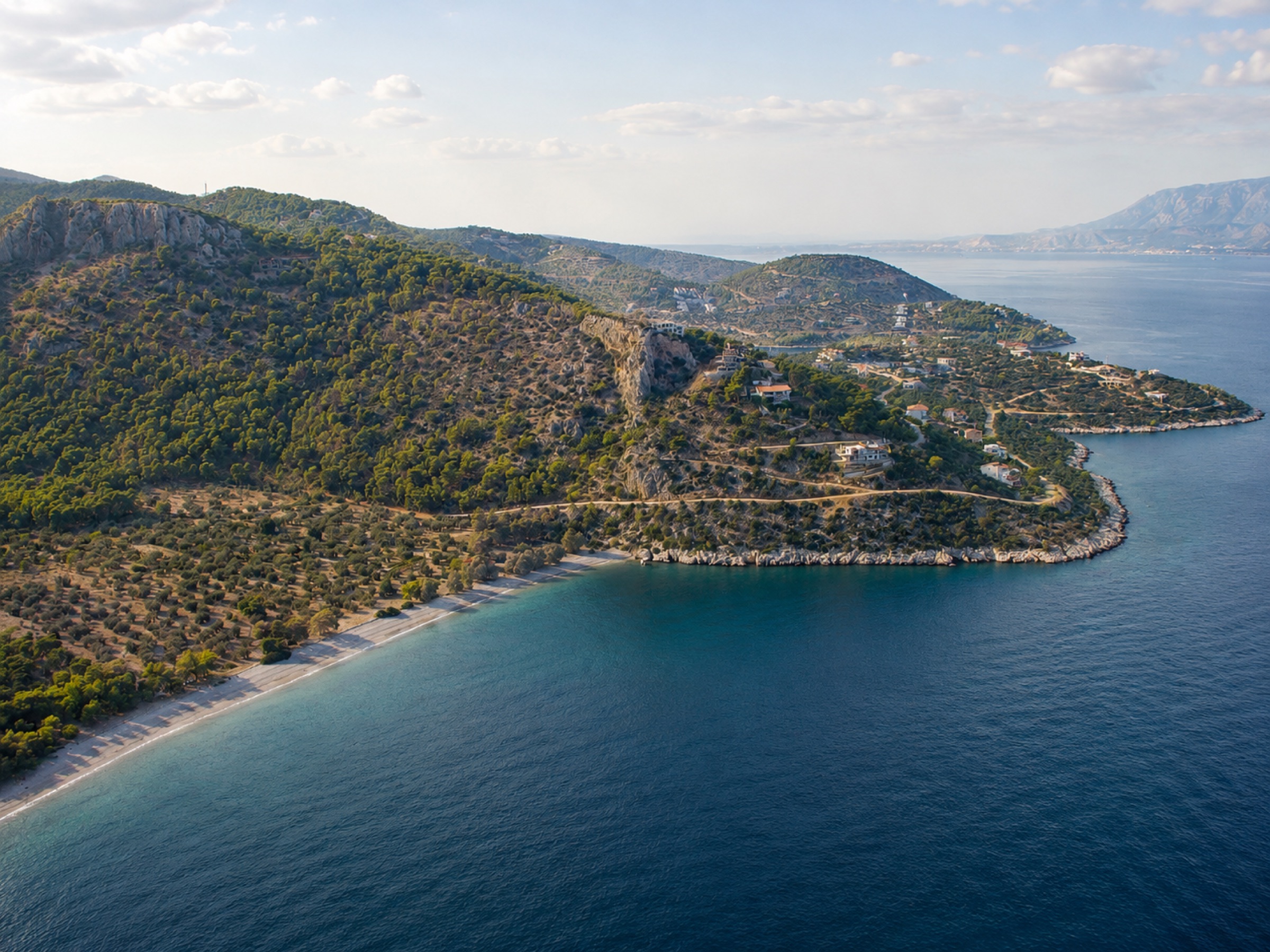 The clear-water rocky and pebble shoreline near Solygia, Corinthia